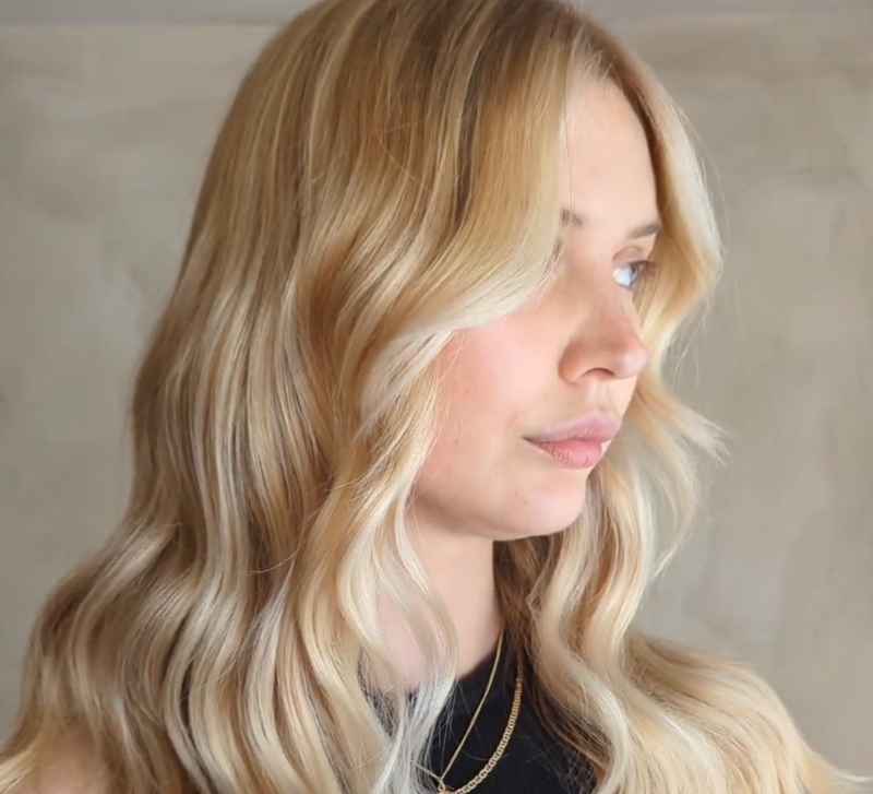 Woman with long blonde wavy hair