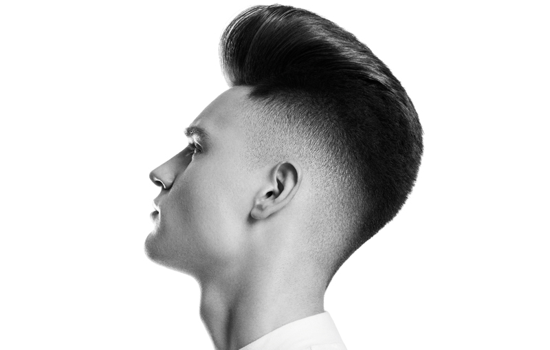 Man with a fade and slicked back hair
