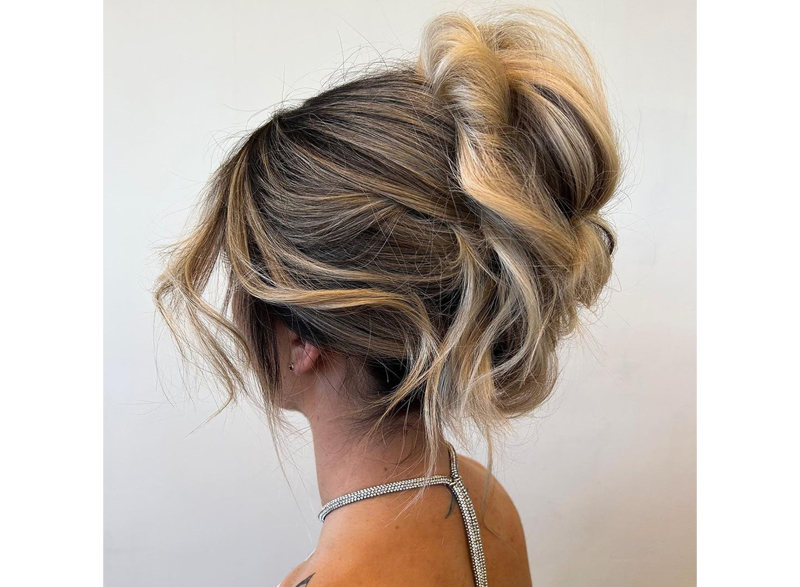 Woman with her hair styled in a twisted upstyle