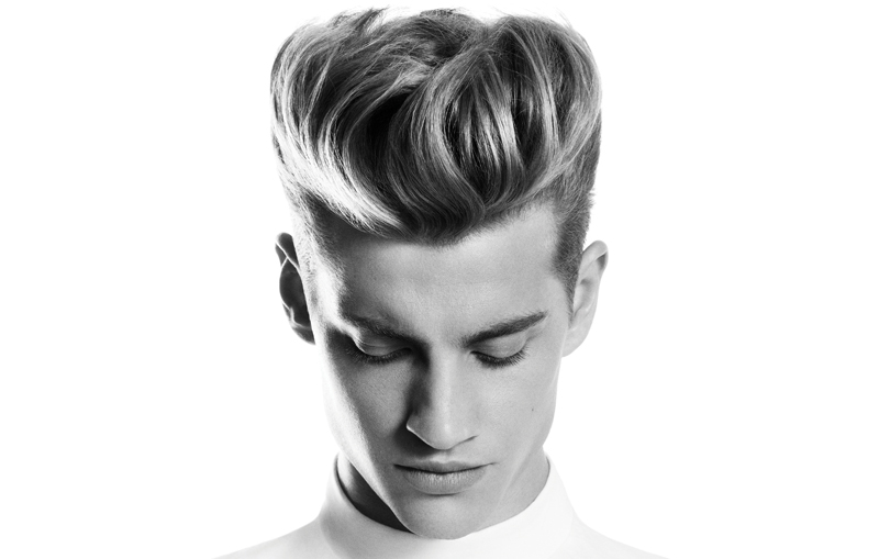 Man with a slicked back high volume hairstyle