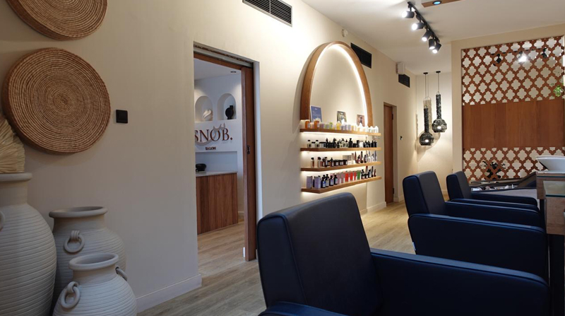 Leather hairstyling station chairs within Snob salon Dubai