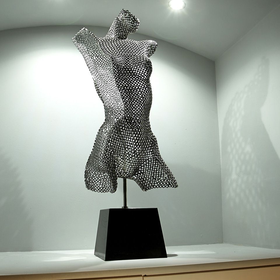 Metal bust displayed in salon waiting area