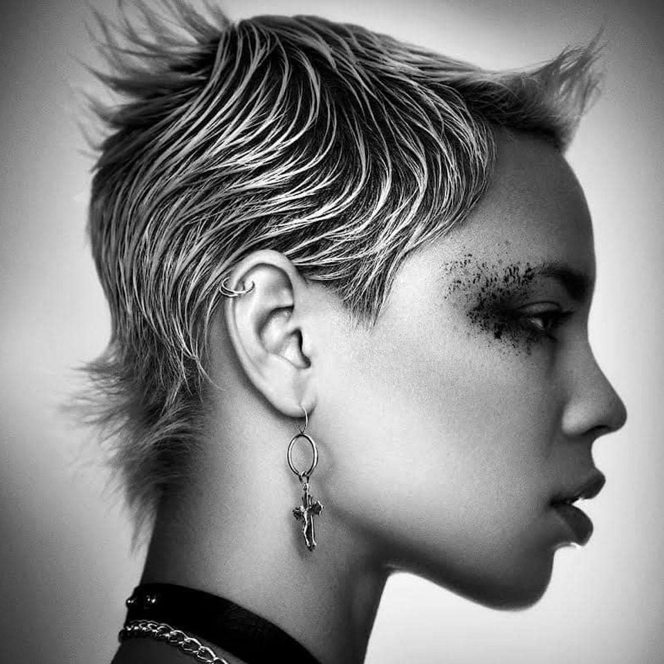 Black and white image of a woman with short hair created by Ego Hair Design