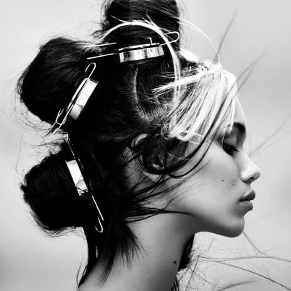 Black and white image of a woman with her hair up created by Ego Hair Design