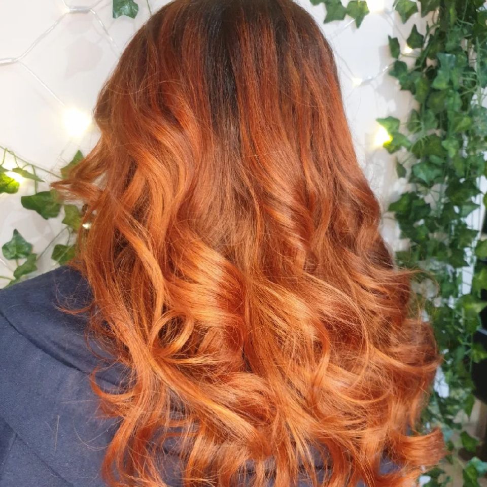 Long curly shiny red head hair style