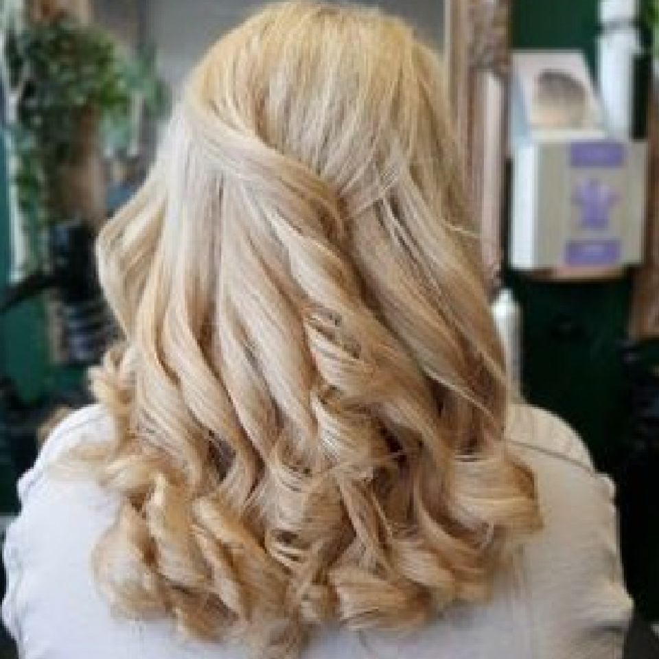 Long curly. Blonde hair twisted to join the curls up