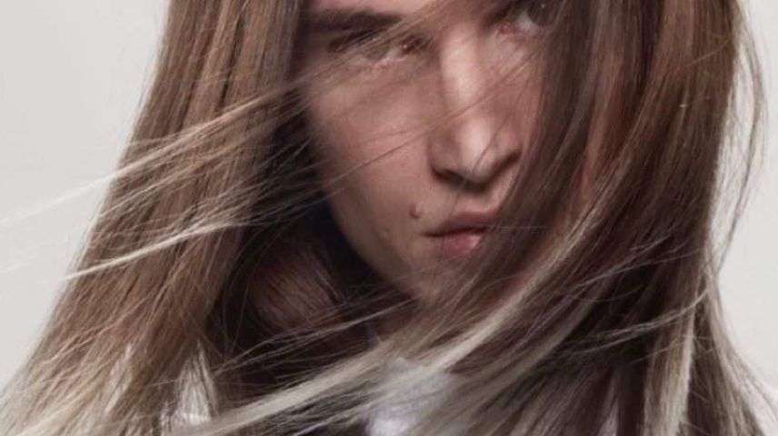 Man with dark hair and blonde frosted tips