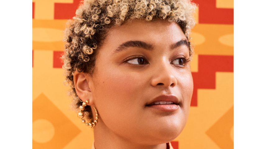 A woman with afro textured blonde hair