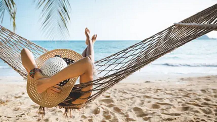 Woman in a hamoc on the beach
