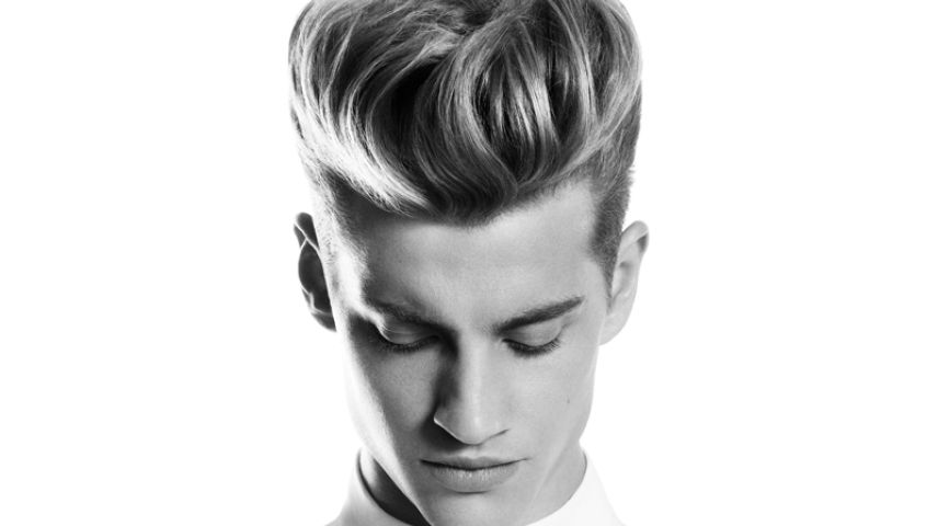 Man with a slicked back high volume hairstyle