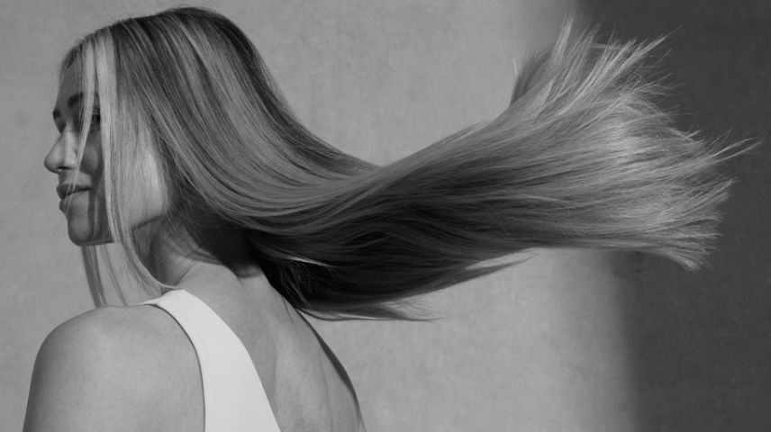 Woman with long blonde hair flowing in the wind
