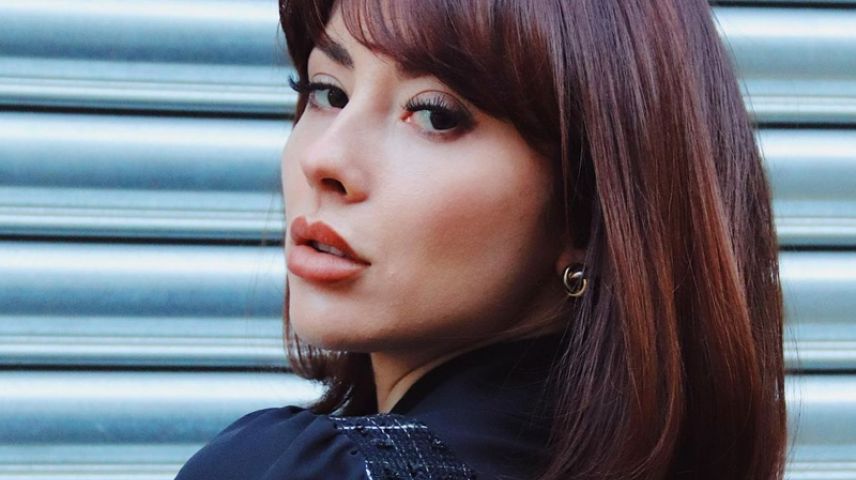 Woman with dark bobbed hair coloured by evo hair colour