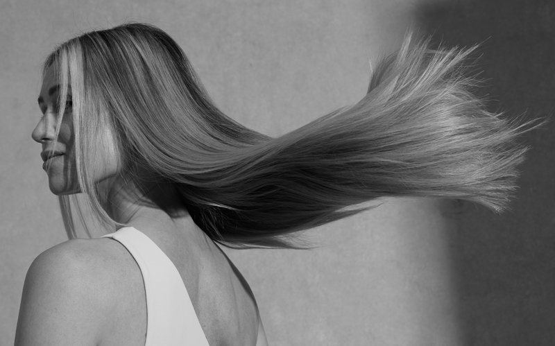 Woman with long blonde hair flowing in the wind