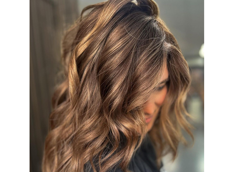 Woman with her hair styled into beach waves